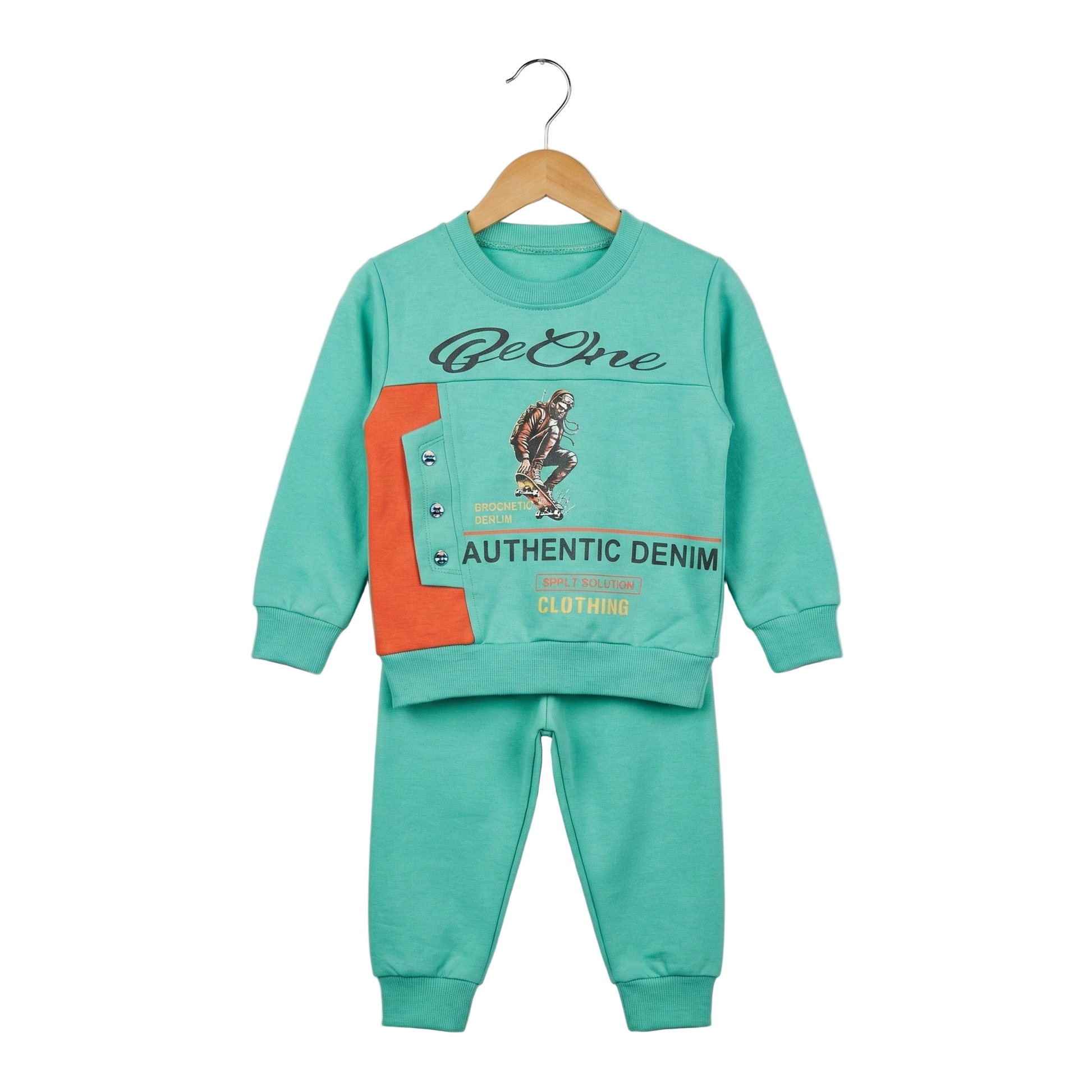 Children's teal sweatshirt and pants set with graphics on a hanger against a light gray background